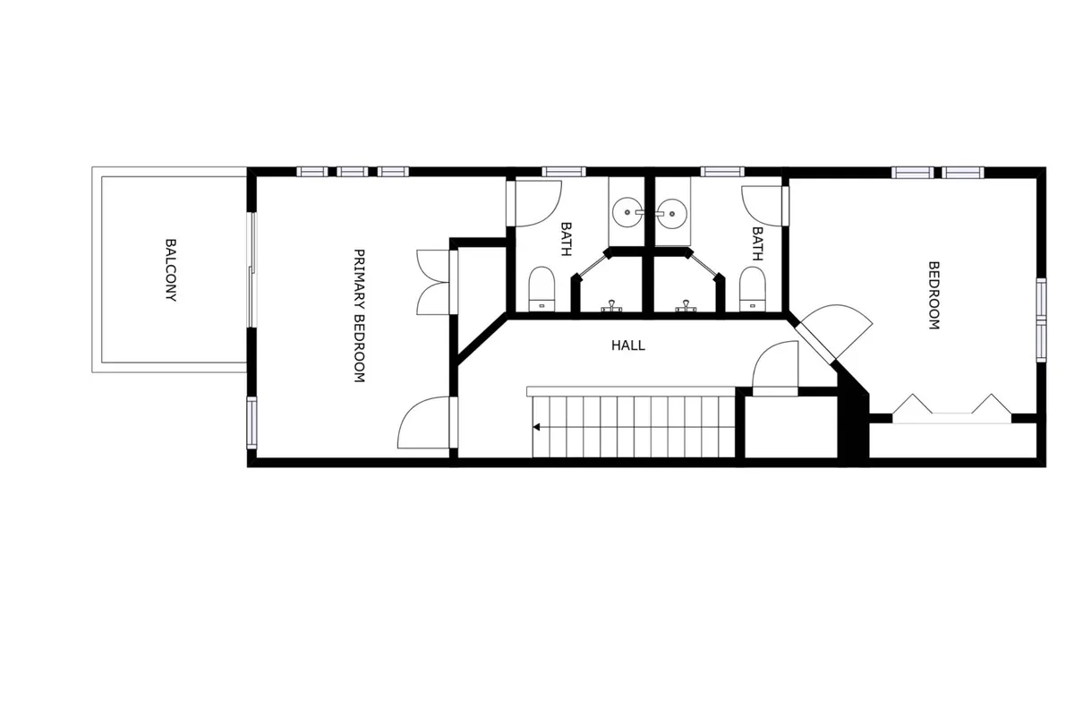A broad view showing the primary bedroom, access to a balcony, and two bathrooms along a hallway. The space is bright, organized, and offers a glimpse of how bedrooms connect to private outdoor spaces and en-suite amenities.